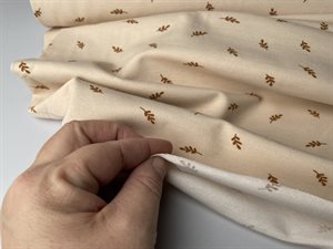 Bomuldsjersey - blid creme med fin lille kvist, gots, rest på 60 cm